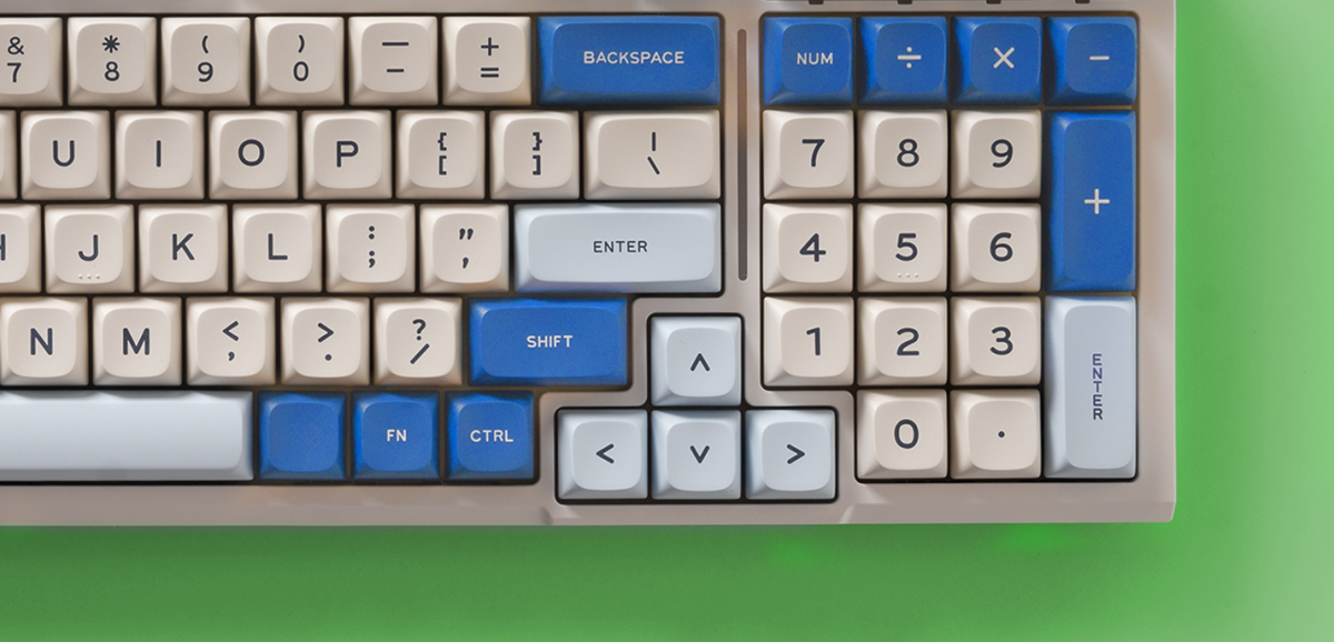 An image of a desktop keyboard with select keys colored blue.