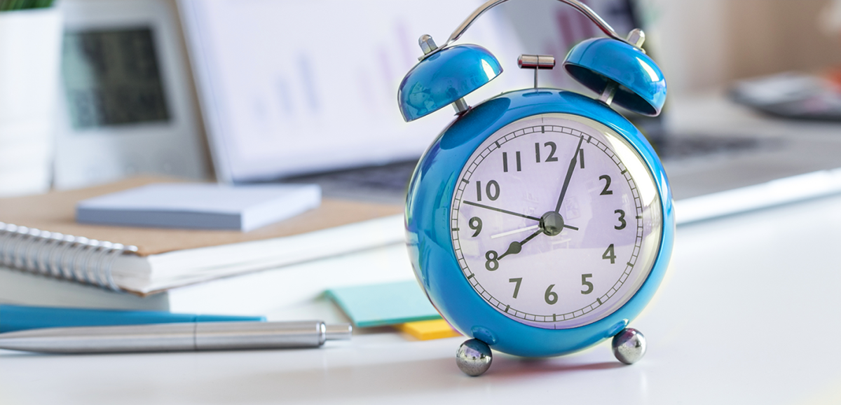 Image of blue analog clock on a table