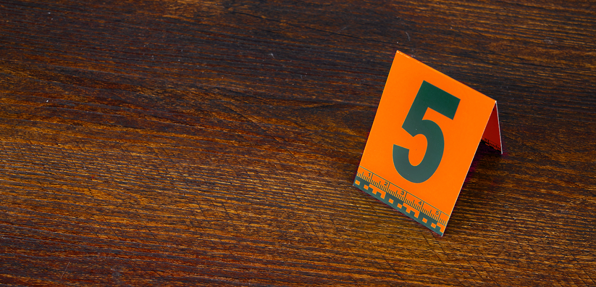 Image of a crime scene tag on the ground.